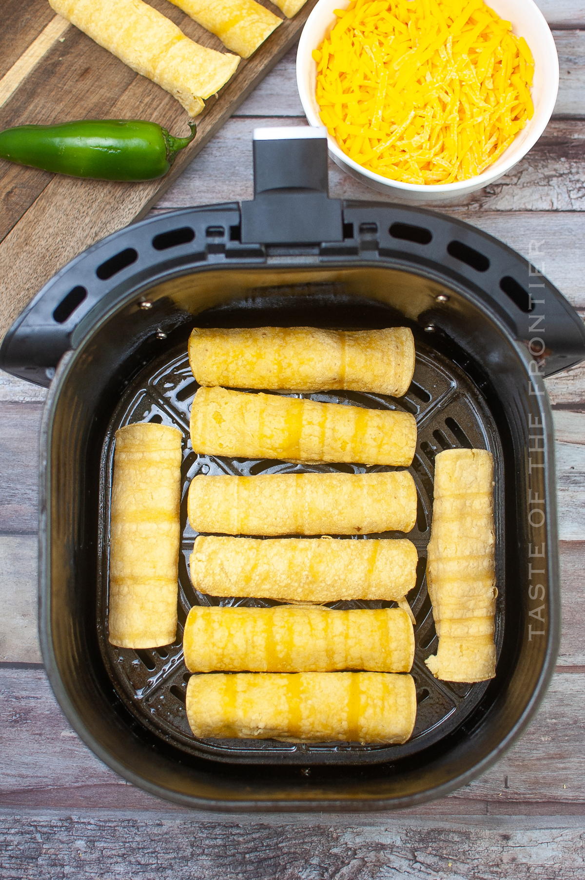 https://www.kleinworthco.com/wp-content/uploads/2022/08/Air-Fryer-Jalapeno-Popper-Taquitos-Ready-To-Cook.jpg