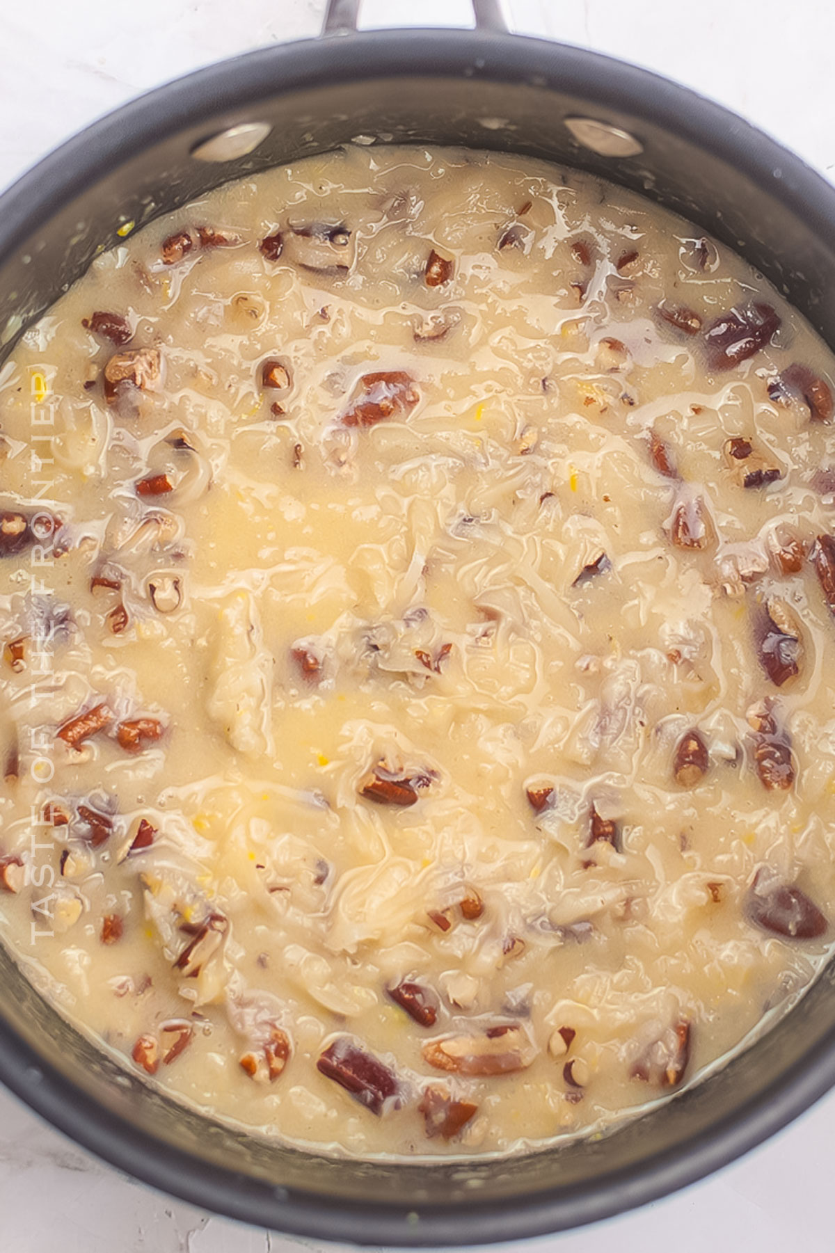 making the coconut pecan frosting