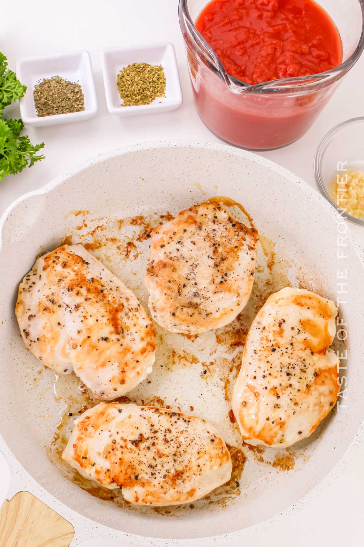 cooking the chicken in the skillet