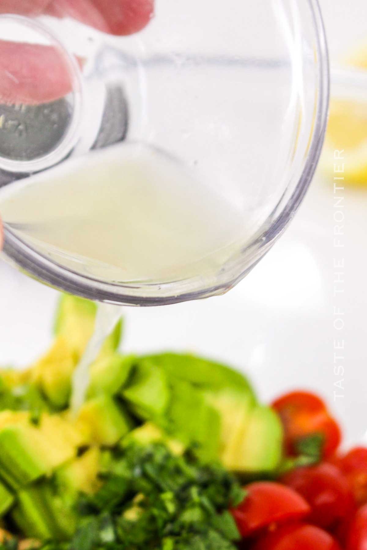 making the salad with the lemon juice