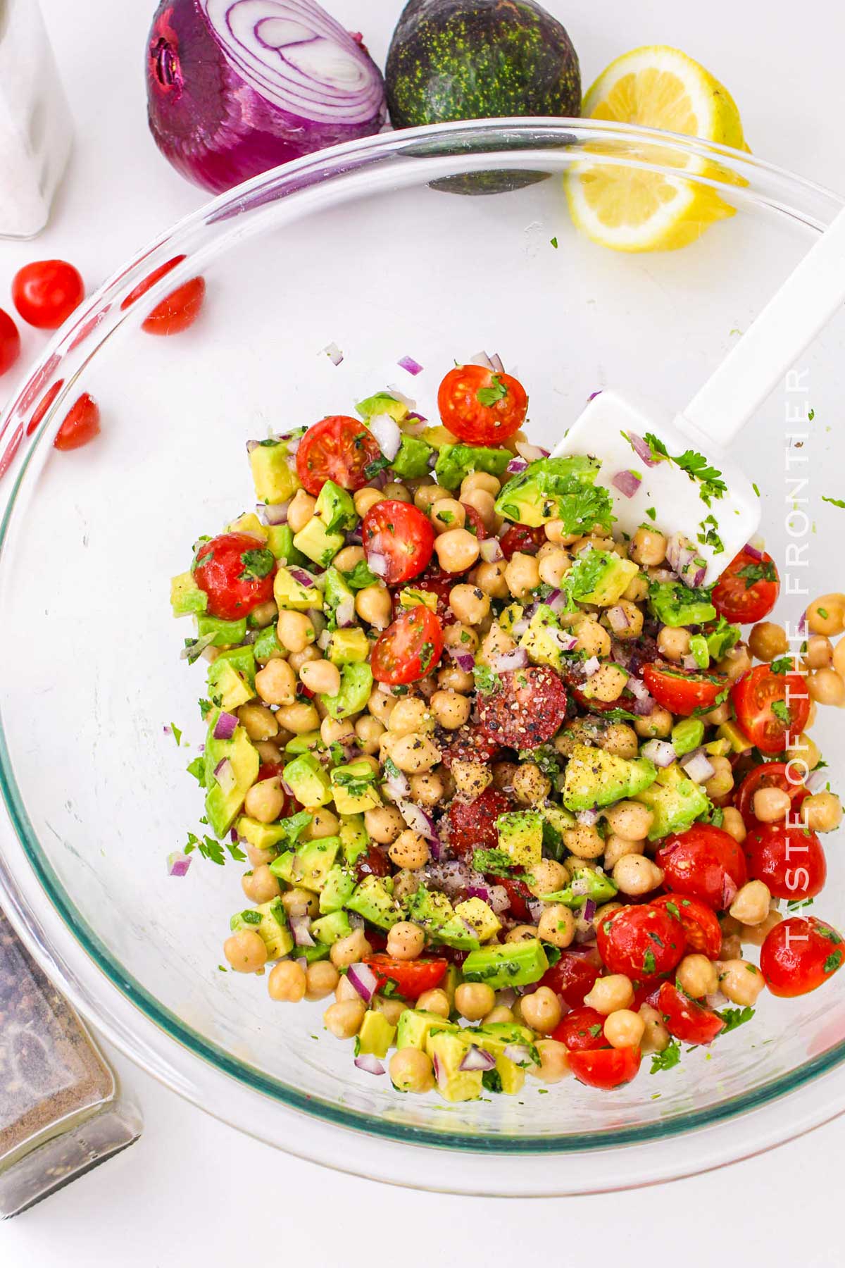 tossing the salad ingredients