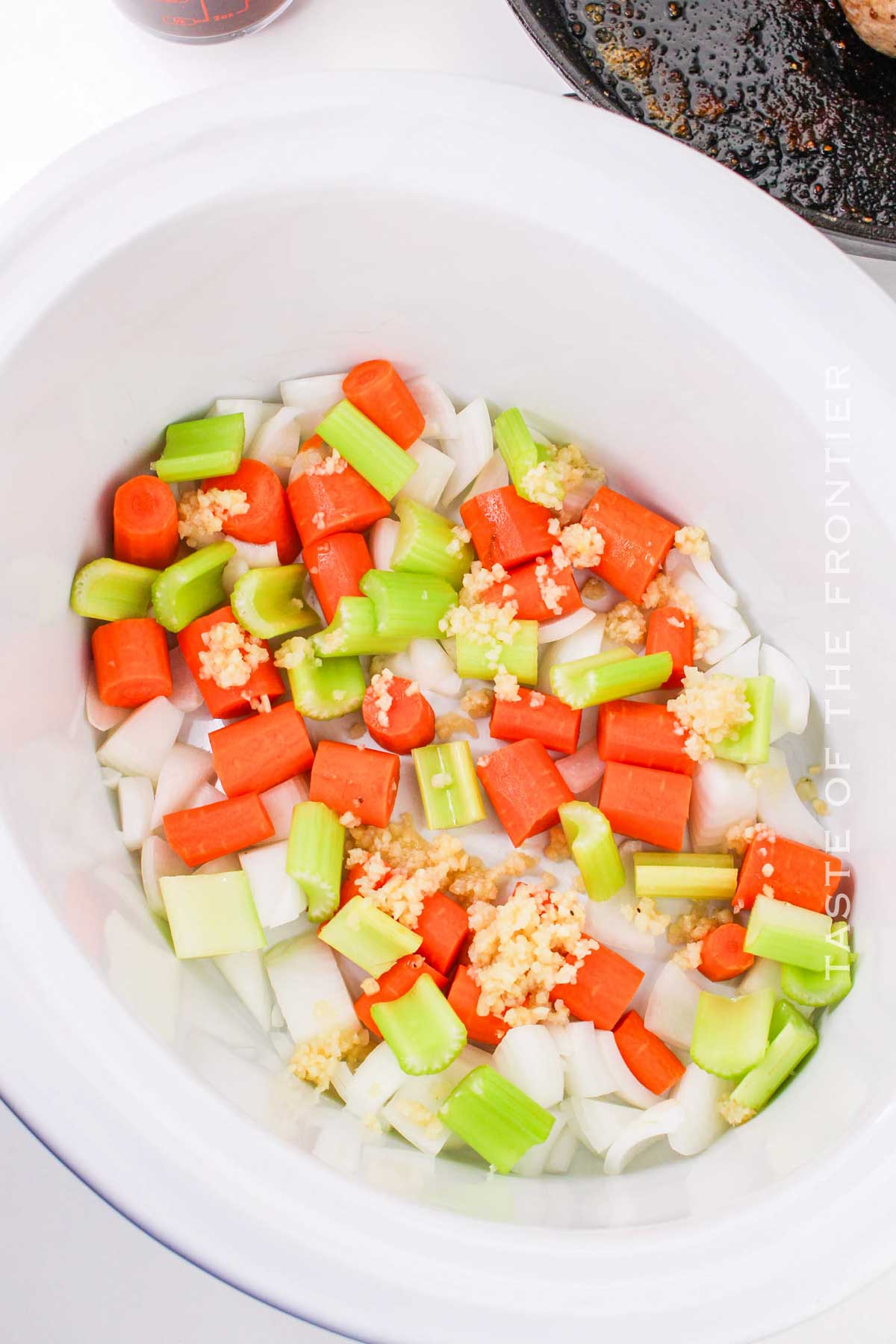 adding the veggies to the cooker