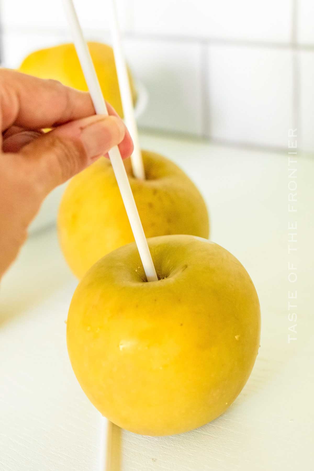 preparing apples with sticks