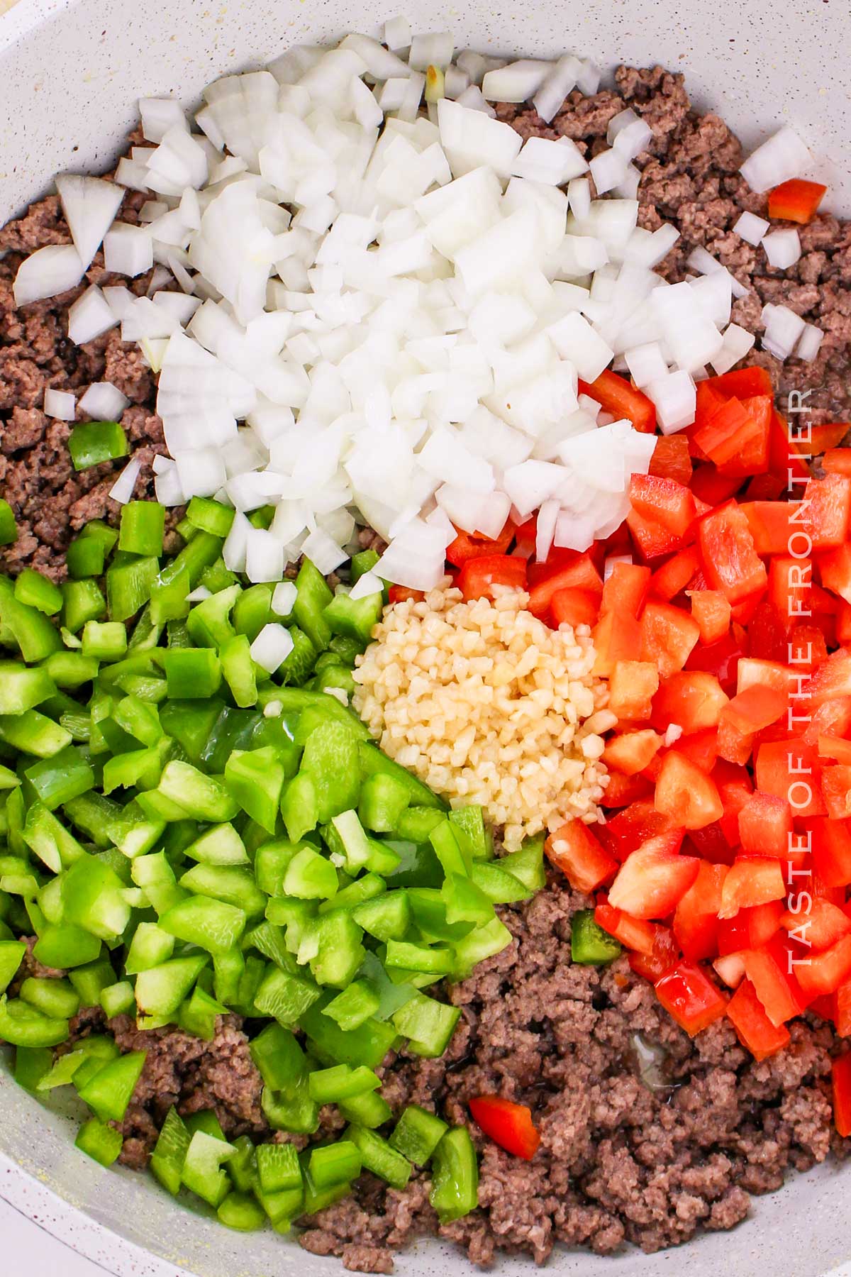 cooking the meat with the veggies