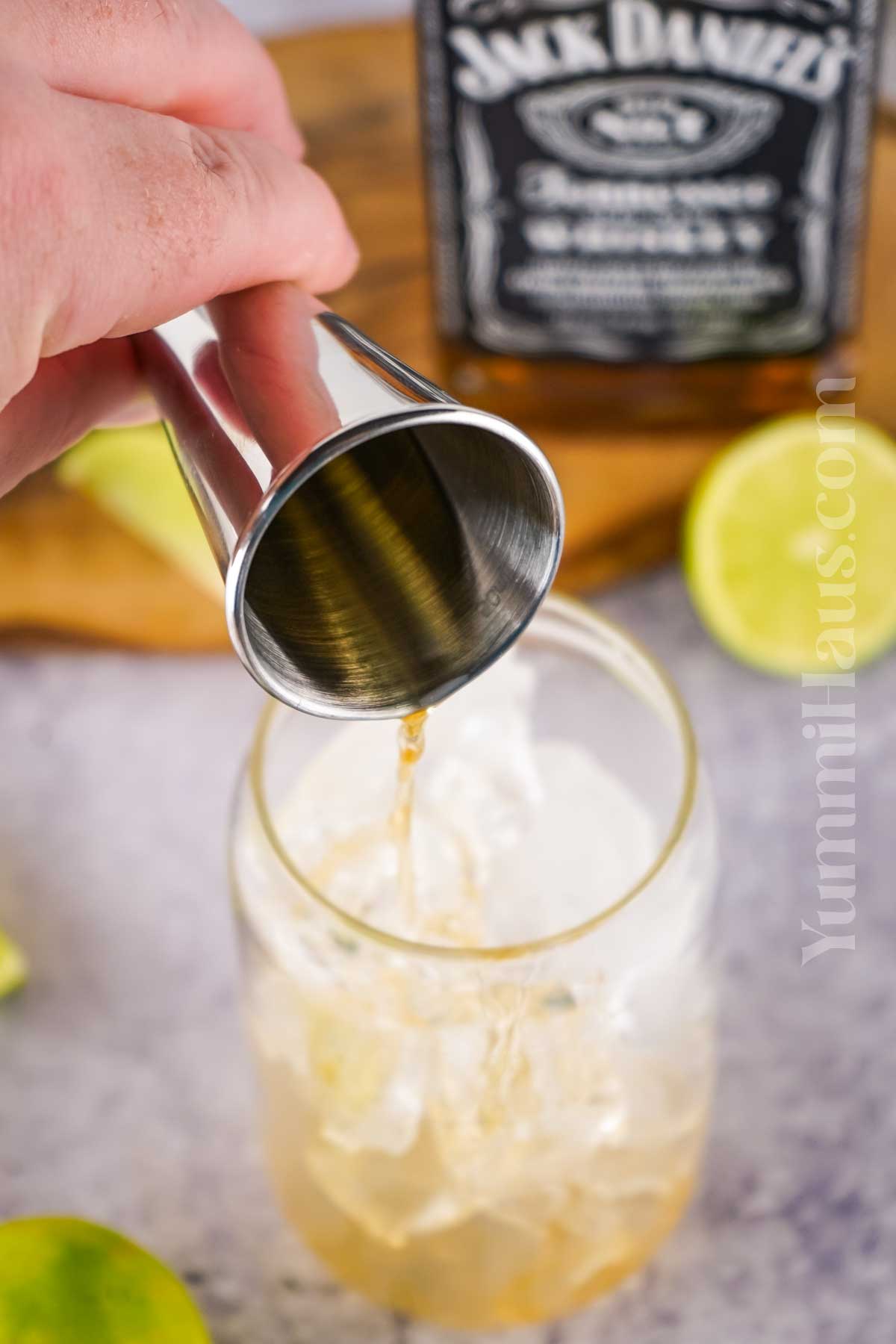 making a whiskey cocktail