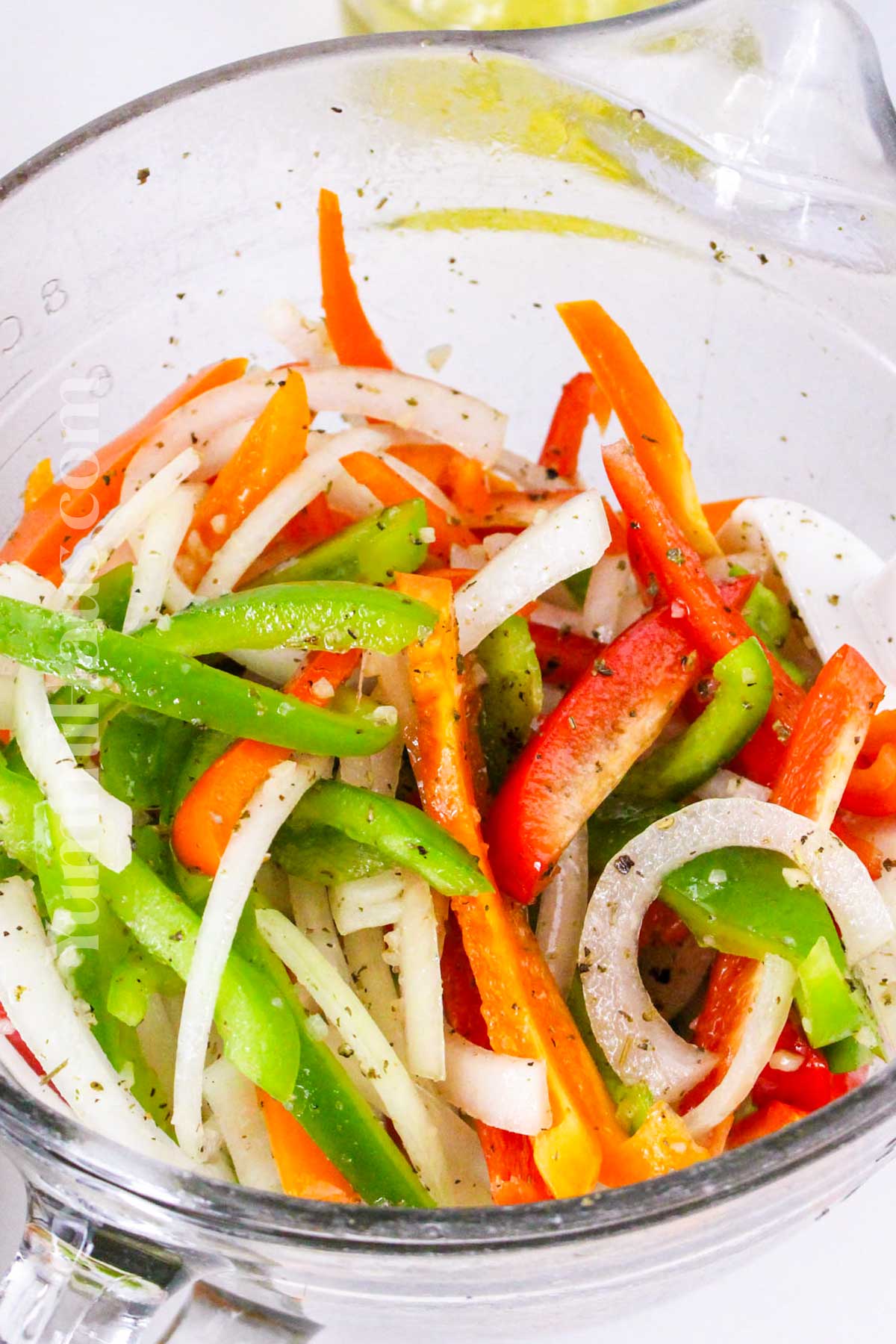 seasoning the peppers and onions