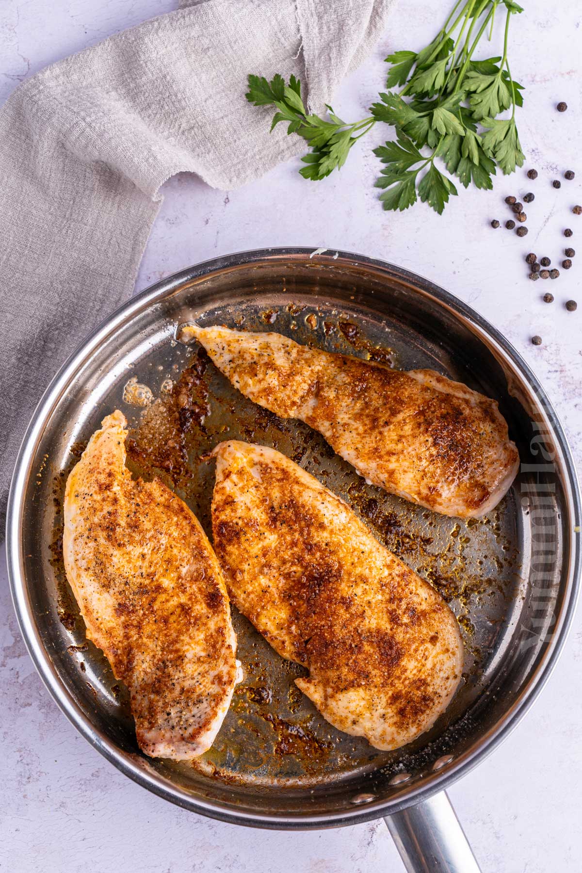 skillet cooking the chicken