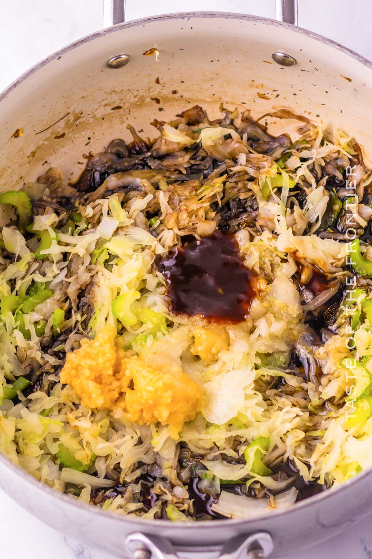 mixing the veggies for the noodles